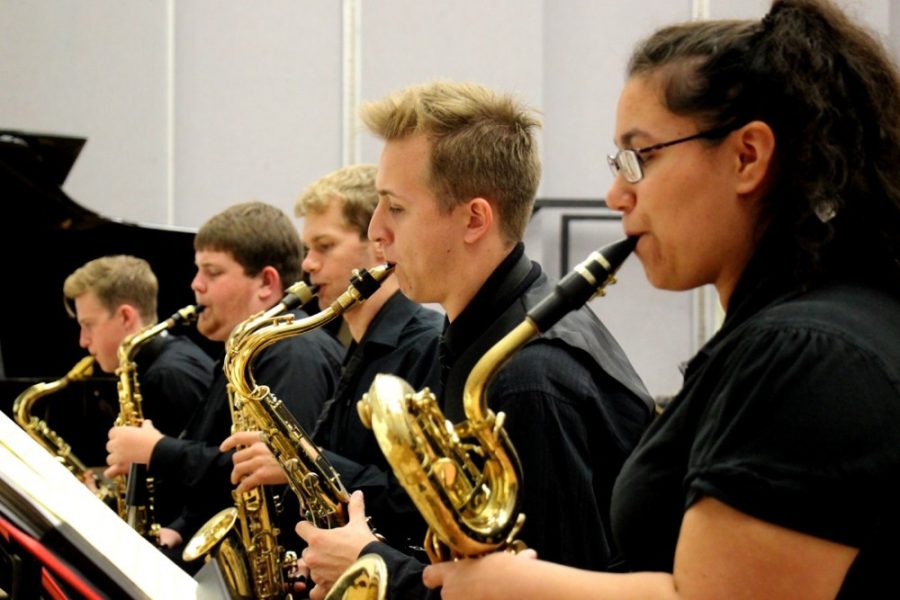The saxophone section of the UA Studio Jazz Ensemble rehearses with the band at the Fred Fox School of Music in 2014. Different ensembles can perform with the UA Musicians on Tour program.