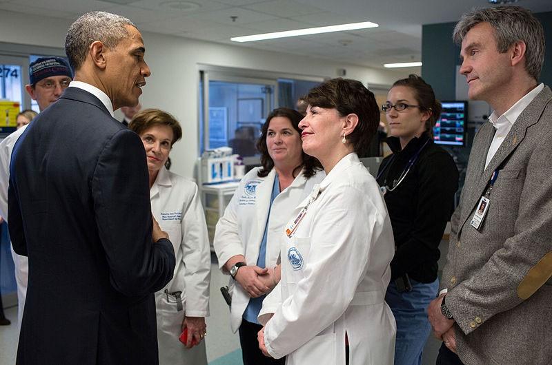 President Barack Obama talks with staff at Massachusetts General Hospital in Boston, Massachusetts on Apr. 18, 2013. It is still unknown if the new replacement plan will provide coverage for pre-existing medical conditions.