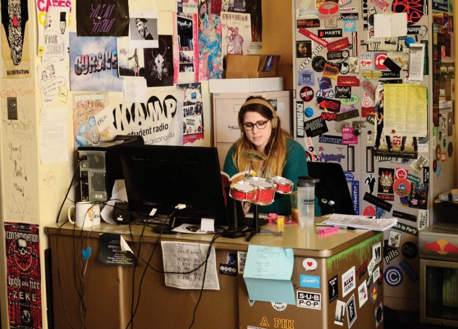 Freshman+Brooke+Blizzard+works+at+her+desk+inside+of+the+KAMP+office+at+Park+Student+Union+on+Jan.+25.+Students+who+work+with+KAMP+can+create+their+own+radio+shows.