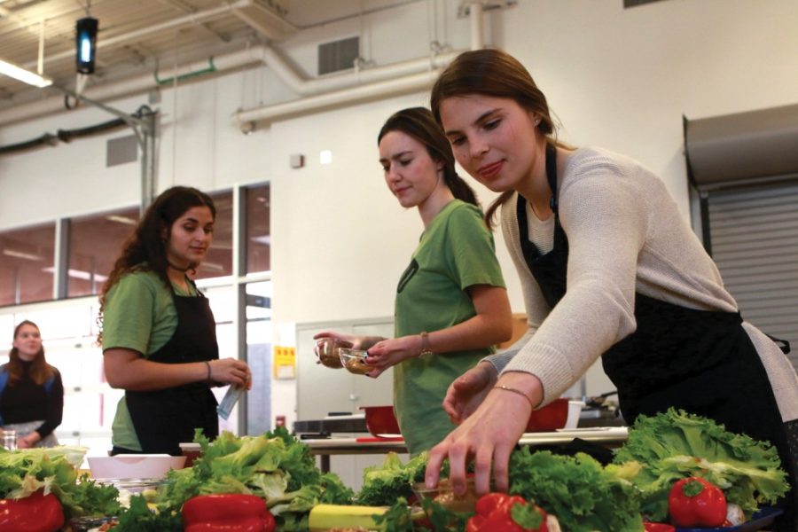 Mckenzie Dryden, a nutritional sciences sophomore, and Lauren Thompson, nutritional sciences and MCB junior, prepares ingredients for the cooking on campus class on Jan. 24, 2017. The class is hosted by the UofA Rec center in Outdoor Adventures.
