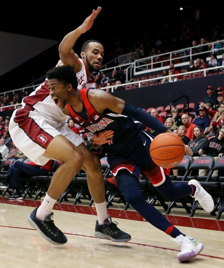 Arizona+Wildcats+guard+Kobi+Simmons+%282%29+drives+into+Stanford+Cardinal+forward+Trevor+Stanback+%2833%29+during+the+second+half+of+the+No.+18+University+of+Arizona+Wildcats+vs.+Stanford+University+Cardinal+mens+college+basketball+game+on+Jan.+1%2C+2017%2C+at+Maples+Pavilion+in+Palo+Alto%2C+Calif.+Arizona+rolled+the+Cardinal+to+win+91-52.+Mike+Christy+%2F+Arizona+Daily+Star