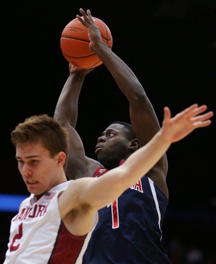 Arizona Wildcats guard Rawle Alkins (1) cuts behind Stanford Cardinal guard Robert Cartwright (2) for a shot during the first half of the No. 18 University of Arizona Wildcats vs. Stanford University Cardinal mens college basketball game on Jan. 1, 2017, at Maples Pavilion in Palo Alto, Calif. Mike Christy / Arizona Daily Star