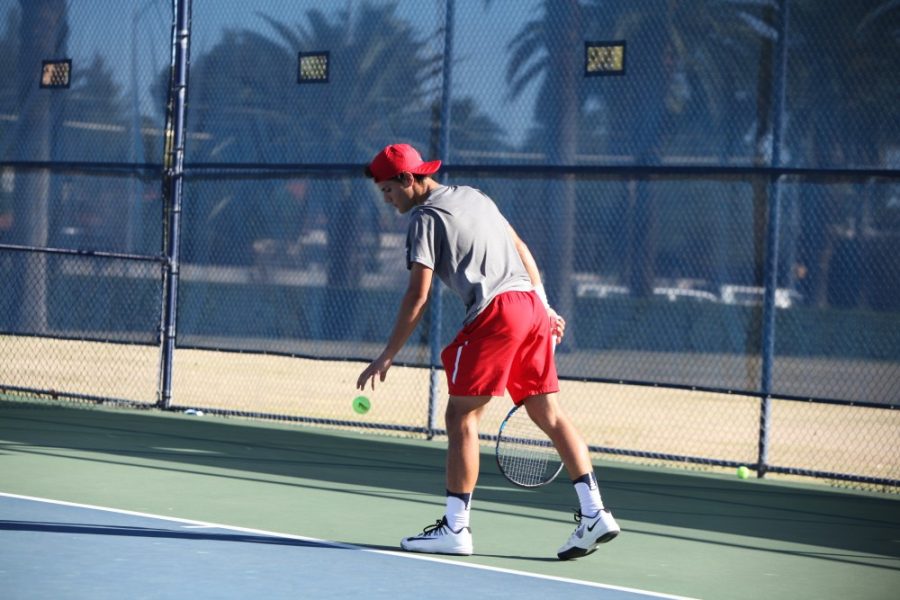 Arizona Mens Tennis player Alejandro Reguant prepares to serve during their match with Utah State on Feb. 10.