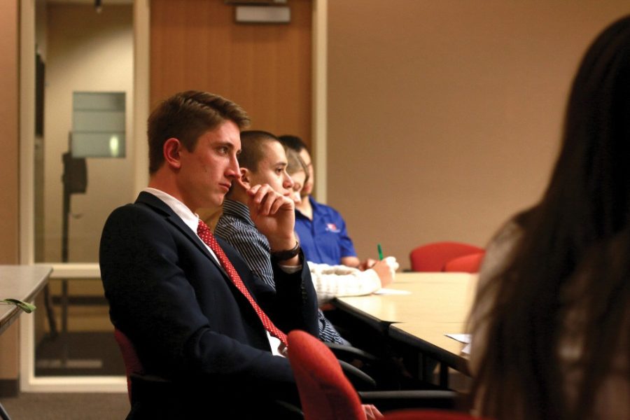 Senator Matt Lubisich, who is running for ASUA president, listens during a senate meeting on Feb. 1. Lubisich was the target of campaign ads placed around campus on Monday, Feb. 6.