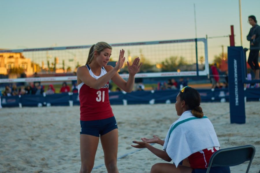 Arizona+defender+Brooke+Burling+%2831%29+high+fives+a+teammate+after+the+beach+volleyball+scrimmage+on+Feb.+24.