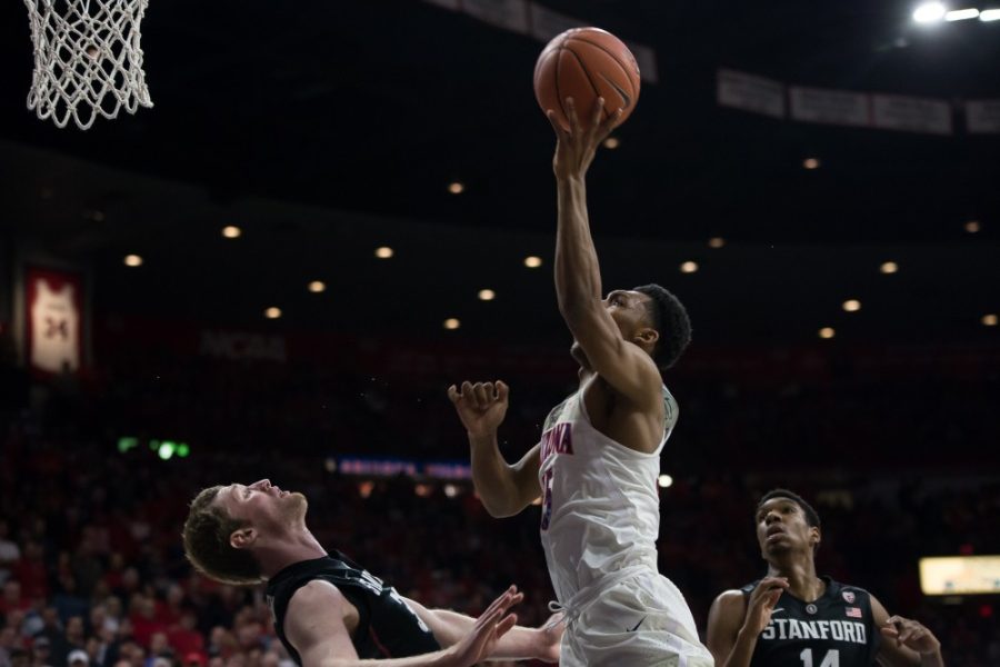 UAs Allonzo Trier shoots over a Stanford player on Wednesday, Feb. 8.