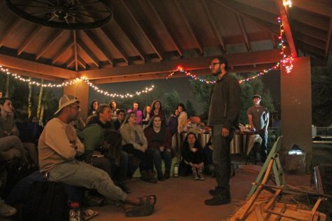 Noble Menchaca, a senior majoring in information sciences, shares his interpretation of self-love with the audience at Stories in the Garden on Feb. 12. The series incorporates food and inspired dialogue in the UA Community Garden.