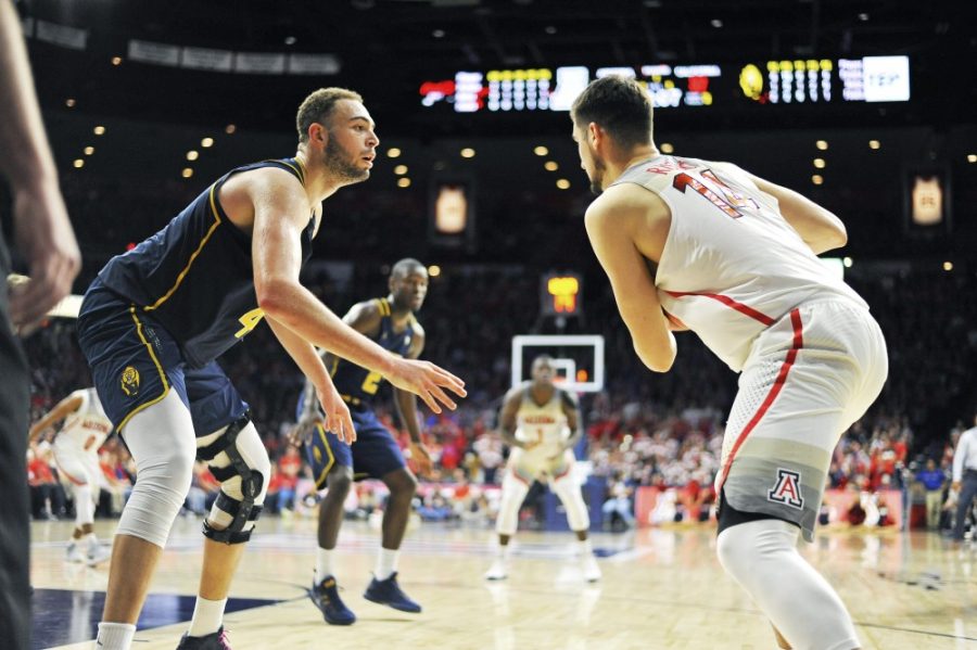 Californias Kameron Rooks (44) guards Arizonas Dusan Ristic (14) during the mens basketball game in McKale Center on Feb. 12. Rooks is the son of former Arizona Wildcat Sean Rooks.