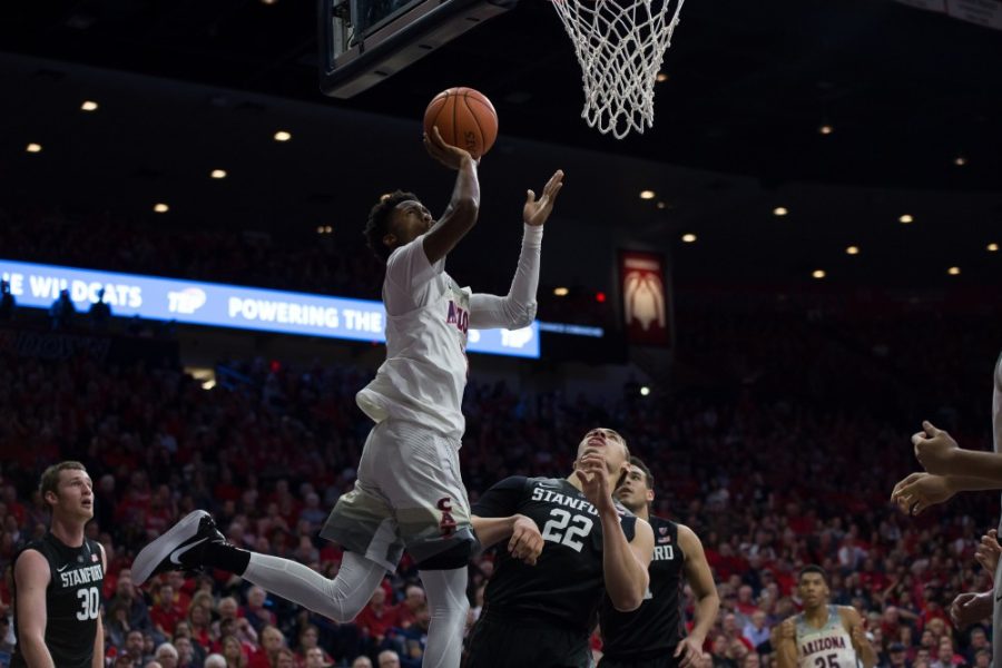 Arizonas Kobi Simmons shoots above Stanfords Reed Travis (22) during the Arizona-Stanford game on Feb. 8. The Wildcats beat the Cardinal 74-67.