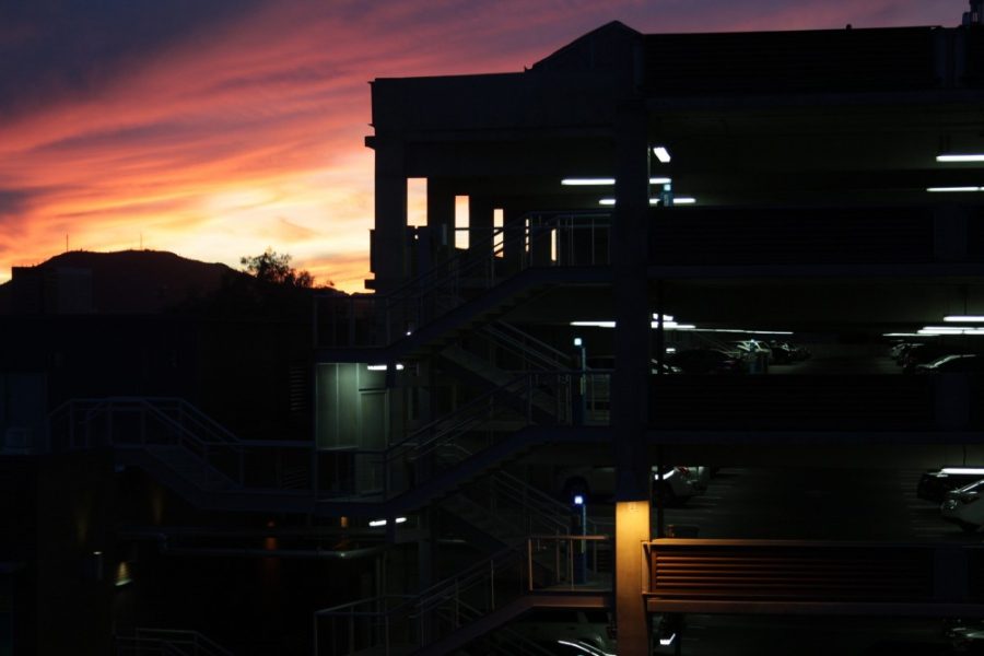 A view of the sunset over Sixth Street Parking Garage from the Campus Health Center.