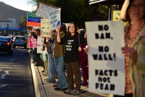 Hundreds of protesters gathered at the State of Arizona Building along the 400 block of Congress Street to protest Pres. Trump's recent travel ban on Tuesday, Jan. 31, 2017. 