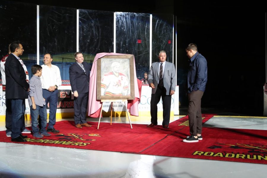 Craig Cunningham receiving a painted portrait of him in a Tucson Roadrunners jersey on March 25. Cunninghams career came to an end Nov. 19, 2016, after collapsing on the ice.