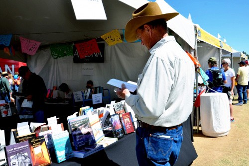 Richard Collins peruses the selection at the University of Arizona Press Tucson Festival of Books tent in 2015. UA Press has been publishing regional scholarly texts since 1959.