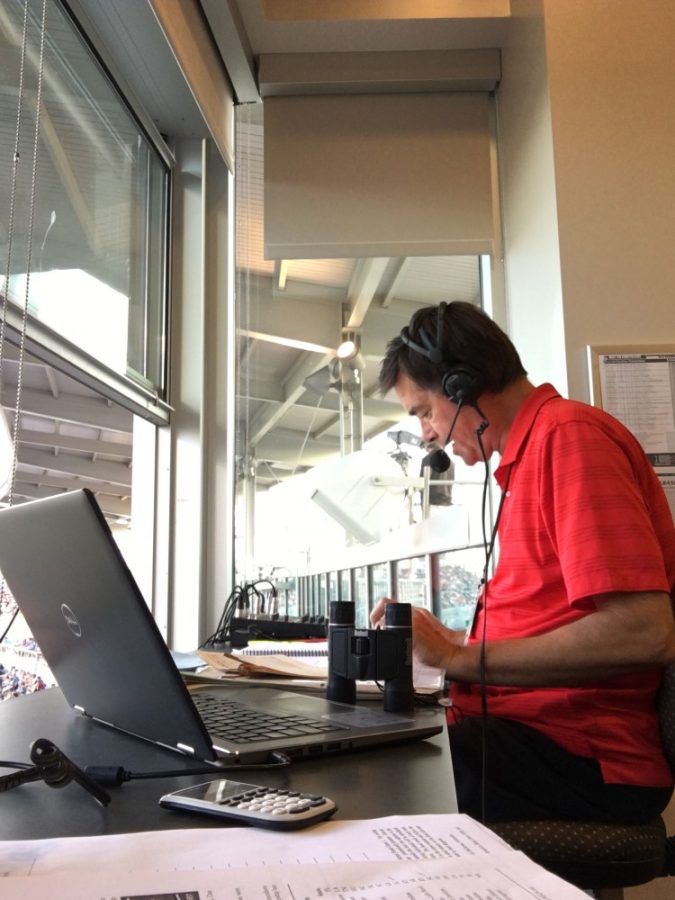 Brian Jeffries preapres for a UA football game in the press box.