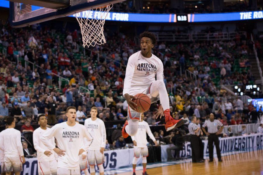 Arizonas Kobi Simmons warms up with a between the legs dunk before the Arizona - North Dakota game on Thursday, March 16.