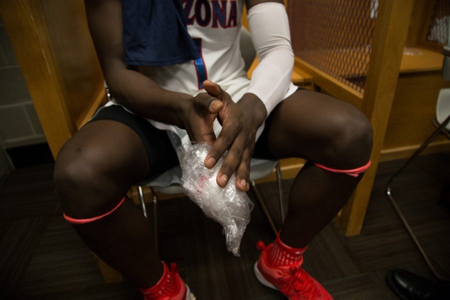 Rawle Alkins holds his dislocated index finger after the Arizona-Saint Marys game on Saturday, March 18.