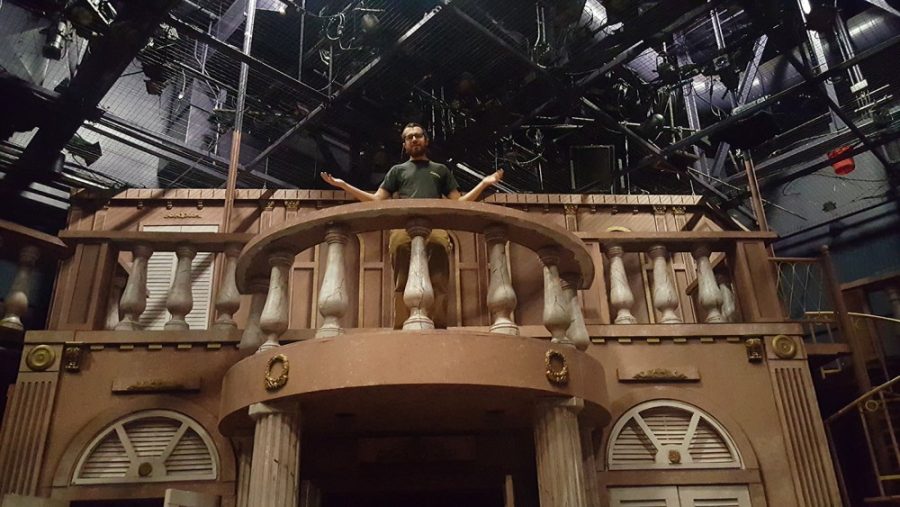 Kyle McGinnis stands on the set of Evita. Evita is currently being performed by the Arizona Repertory Theatre.