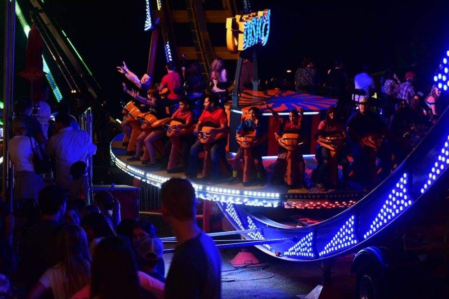 Spring Fling festival-goers ride the Disko during 2015s Spring Fling. Ray Cammack Shows has provided rides and services during Spring Fling for 35 years.