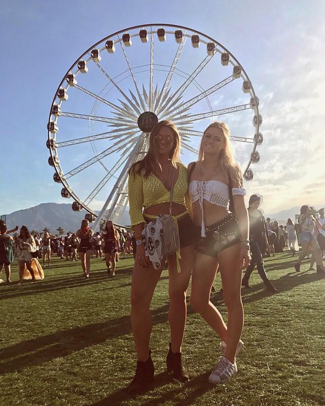 Students Julia Patterson and Emily Looney pose in front of the Ferris wheel at Coachella Music and Arts Festival in Indio, California on Saturday, April 15. The two are roommates and went to the festival together.
