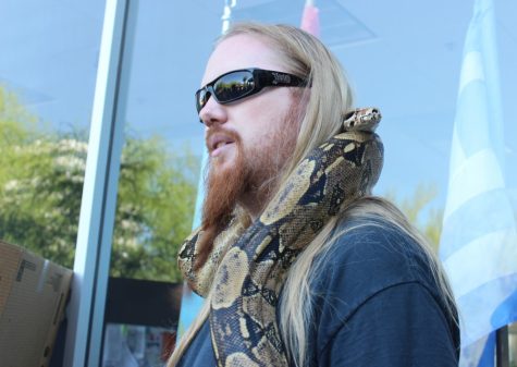 Jacob and his python participate in the March for Science Rally at El Presidio Park on April 22. Jacob works with many reptiles and insects and has been stung by many venomous insects.