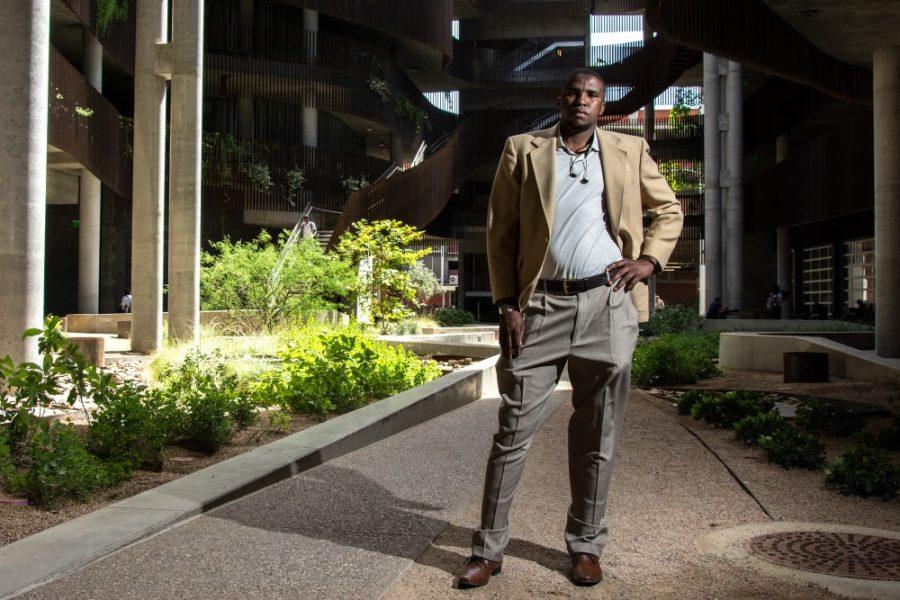 Abdi Chirango, a Somali refugee who has lived in Tucson for the last 12 years, poses for a portrait in the Environment and Natural Resources 2 building courtyard on Tuesday, April 25, 2017. Chirango graduated from the UA in 2014 with a degree in political science. (Alex McIntyre/The Daily Wildcat)