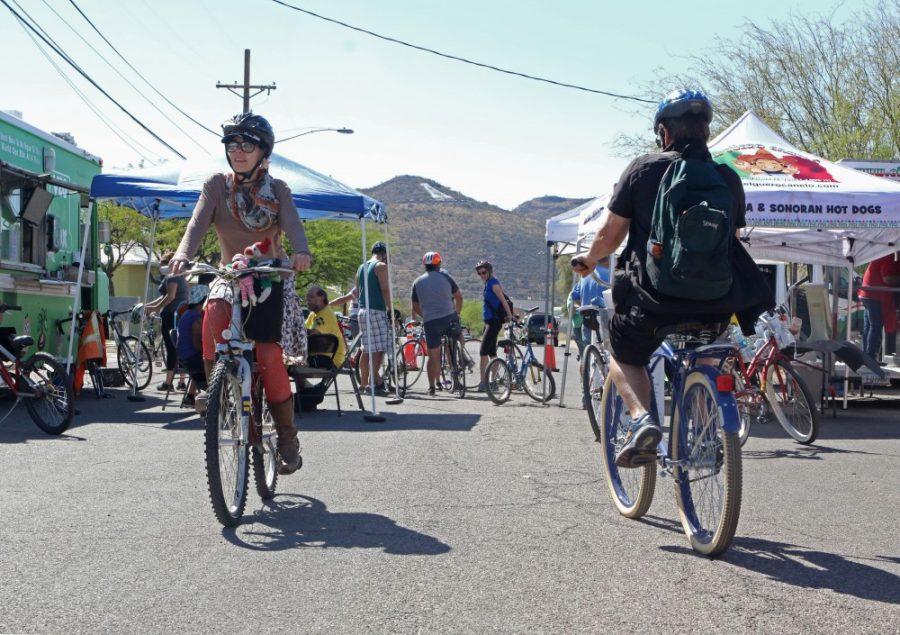 Cyclists ride down colorful neighborhood streets and check out fun tents containing DJs, coffee, ice cream, street tacos and local sustainability initiatives at Cyclovia on April 2. 