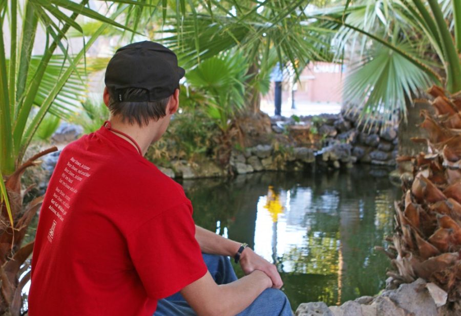 Keegan Blackburn enjoys a miniature oasis. This small pond, located east of Park Avenue on Second Street, is home to some turtles, fish and palm trees, making it an ideal location for reflection and relaxation.