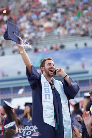 Jack Dulgarian waves to his family and friends before the 153rd Annual UA Commencement on Friday, May 12.