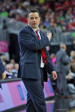 Arizona men's basketball head coach Sean Miller calls a player to the court during the Arizona-Oregon game on March 11. The Wildcats defeated Oregon 83-80 in the Pac-12 Tournament championship game. 