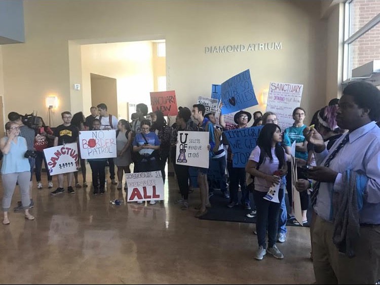 DACA students protest during an Arizona Board of Regents meeting at the UA in April. 