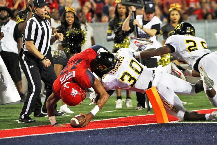Arizona quarterback Brandon Dawkins (13) scores the first touchdown of the game against Grambling State on Sept. 10, 2016. Dawkins ran for two touchdowns and rushed 223 yards leading the Wildcats to victory, 31-21.