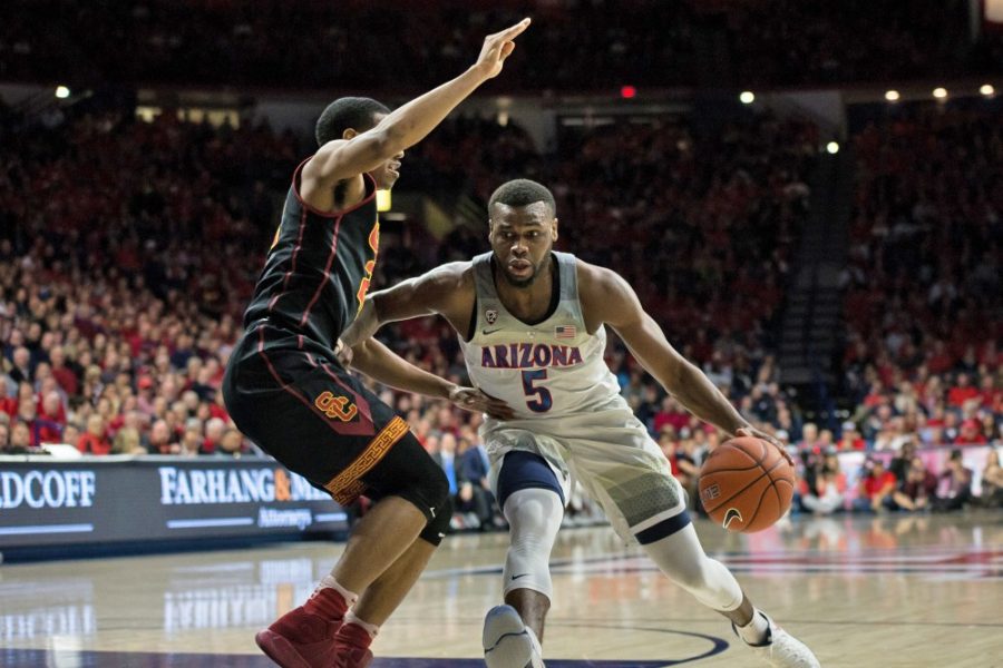 Arizonas Kadeem Allen (5) dribbles past a USC defender during the UA-USC game on Thursday, Feb. 23 in McKale Center. Allen was selected 53rd overall by the Boston Celtics.