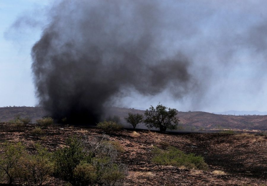 As the wind kicks up, what might normally be a dust devil becomes an ash devil in the charred landscape near Empire Ranch, while the Sawmill Fire burns on April 27 in Southeastern Arizona between Green Valley and J-6. Southern Arizonas wildfires are a relatively common occurrence.