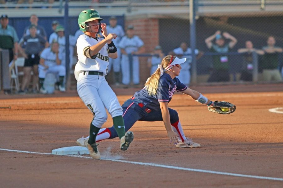 Arizona+infielder+Jessie+Harper+makes+a+catch+as+a+Baylor+runner+crosses+first+base+during+a+game+on+May+27+at+Hillenbrand+Stadium.+Arizona+was+eliminated+by+Baylor%2C+preventing+them+from+making+the+Womens+College+World+Series+for+the+seventh+consecutive+season.