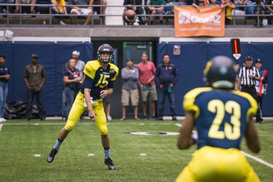 Sophomore quarterback Case Cookus passes to Junior running back Corbin Jountti Sept. 17, 2016 in Walkup Skydome. Cookus throws for 7 touchdown passes Saterday. (Photo by Michael Patacsil)