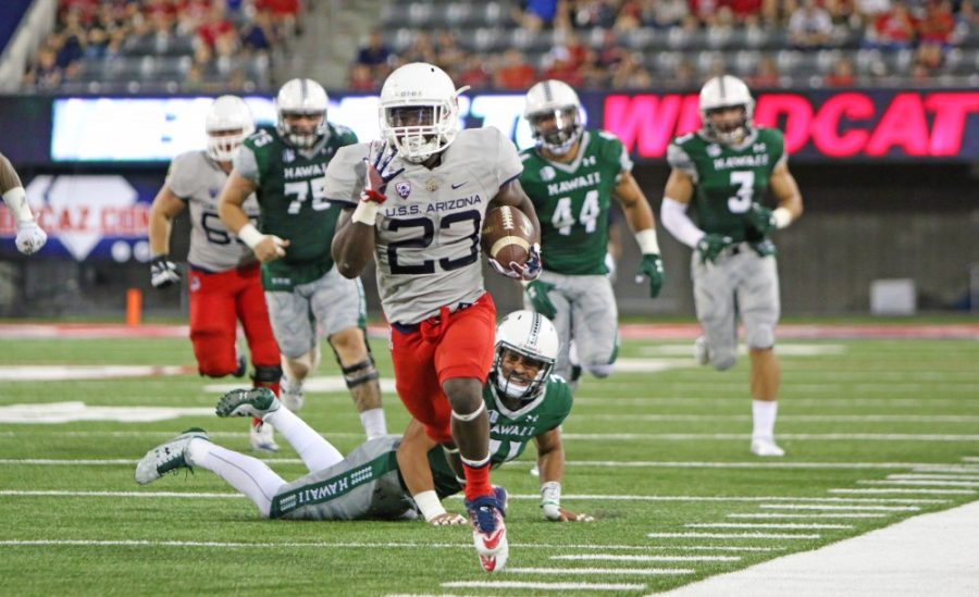 Arizona running back JJ Taylor runs toward the end zone for a touchdown against University of Hawaii on Sept. 16, 2016.