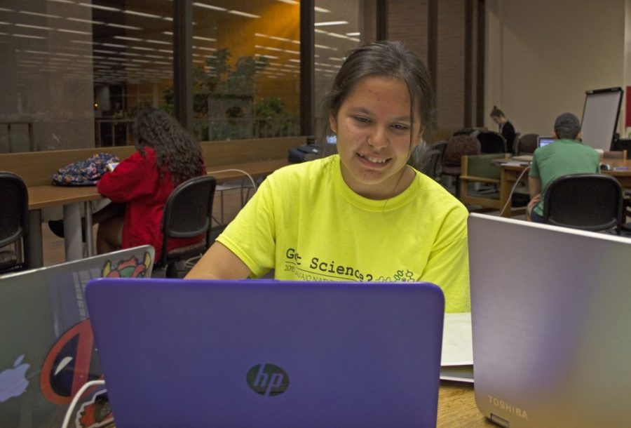 Nizhonabah Davis finishes up her homework at the UA Main Library on Aug. 29. Davis comes from Ganado, Ariz. in the Navajo Nation and is pursuing engineering.