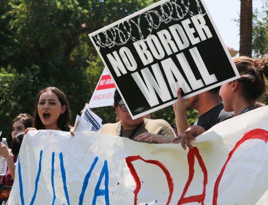 A+No+Border+Wall+sign+takes+place+at+the+front+of+the+pro-DACA+protest+on+Sept.+5.