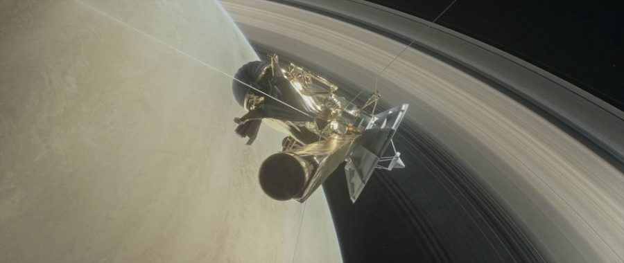 This illustration shows NASAs Cassini spacecraft about to make one of its dives between Saturn and its innermost rings as part of the missions grand finale.