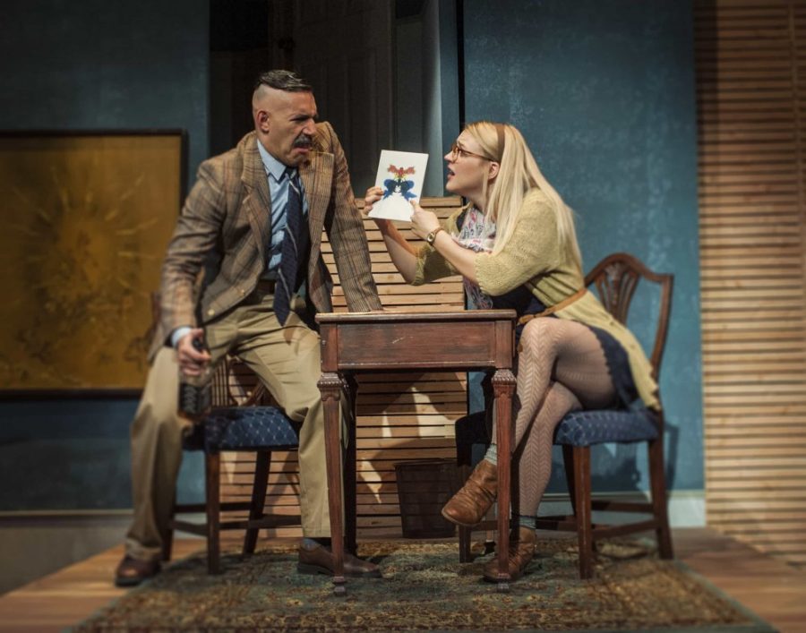 Sherry (Kelly Hajek), right, tries to get Joseph (Alec Coles), left, to say what he sees in the ink blot in Arizona Repertory Theatre’s comedy production of Tigers Be Still.