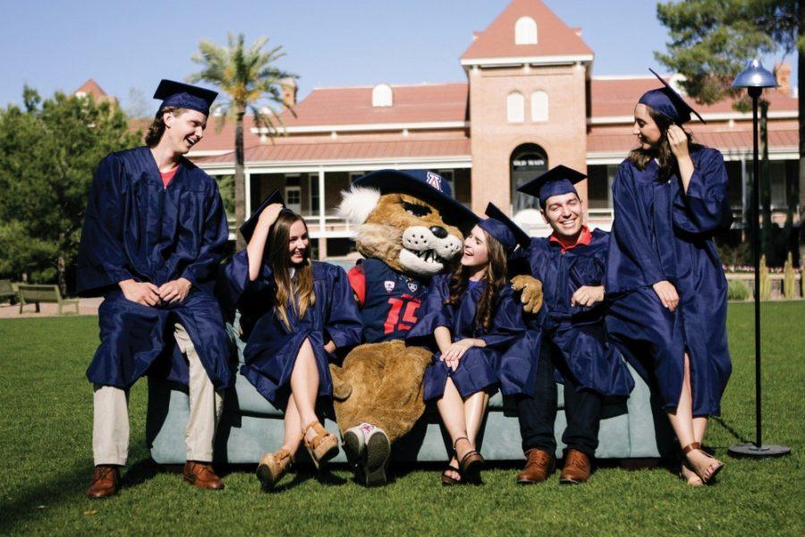 2016+graduating+seniors+pose+with+Wilbur+Wildcat+on+a+couch+outside+Old+Main.