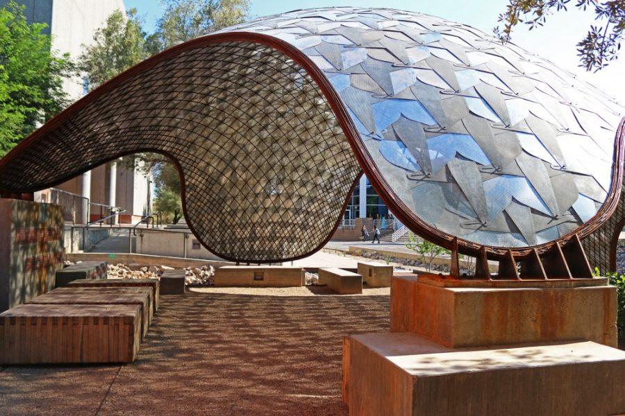 An exterior view of the Sonoran Pentapus outside of the College of Architecture, Planning and Landscape Architecture. The sculpture is part of a multi-university study in creating grid-shell structures.