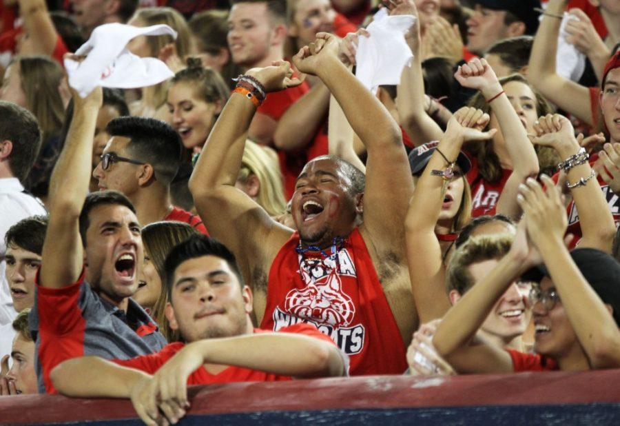Arizona fans in Zona Zoo celebrate during the UA-Utah game on Sept. 22 at Arizona Stadium.