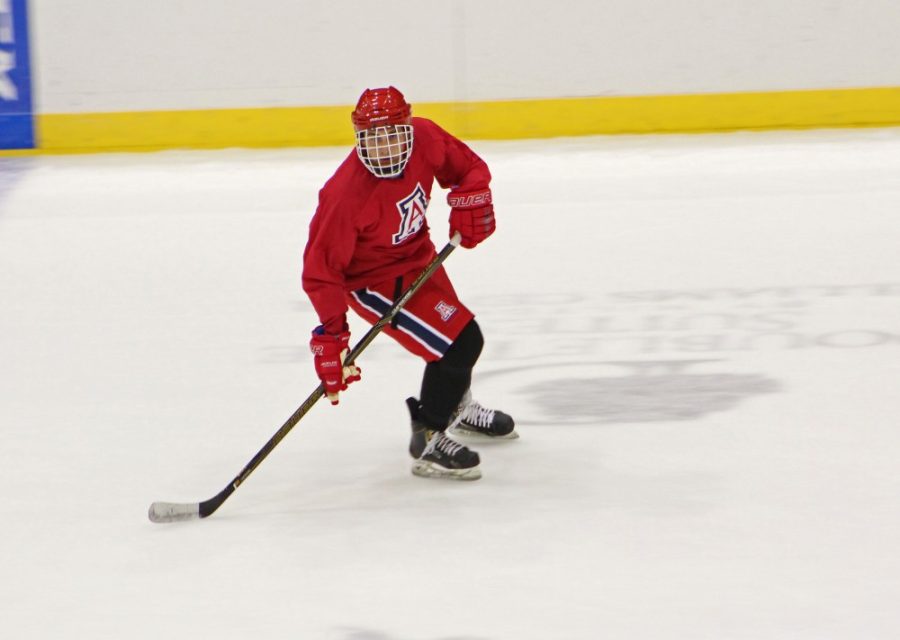 An Arizona hockey player plays in the game for the Media Day event on Sept. 28 at Tucson Arena.