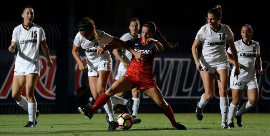 
Arizona midfielder Gabi Stoian (9) swoops in to regain possession ahead of a group of Colorado players at Murphey Field at Mulcahy Soccer Stadium on Thursday, Sept. 29, 2016.