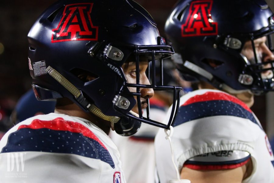 Khalil Tate stares onto the field and watches Arizona defense push against strong USC offense.