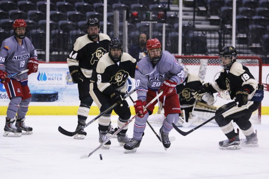 Arizonas Manny Rowe (20) skates past CU players during the hockey game at Tucson Convention Center on Nov. 2
