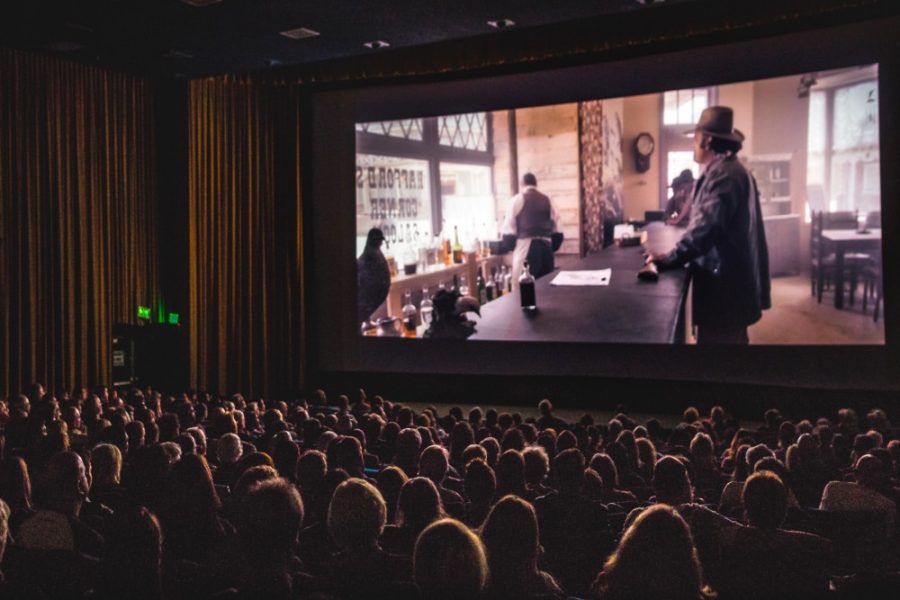 A crowd watches Alex Coxs Tombstone Rashomon at the 2016 Loft Film Fest.