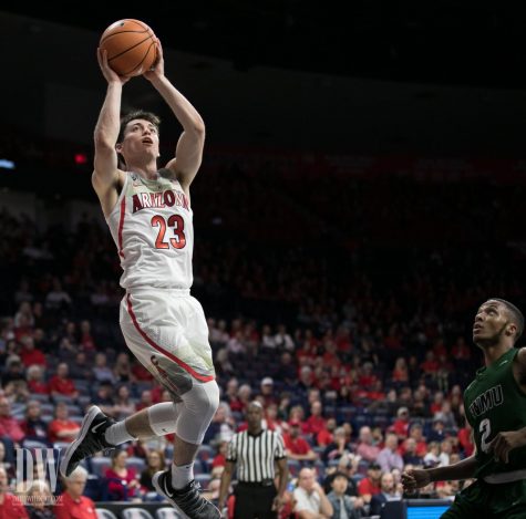 Arizona's Alex Barcello finishes an alley-oop during the second half of the Arizona-ENMU game on Wednesday, November 1.