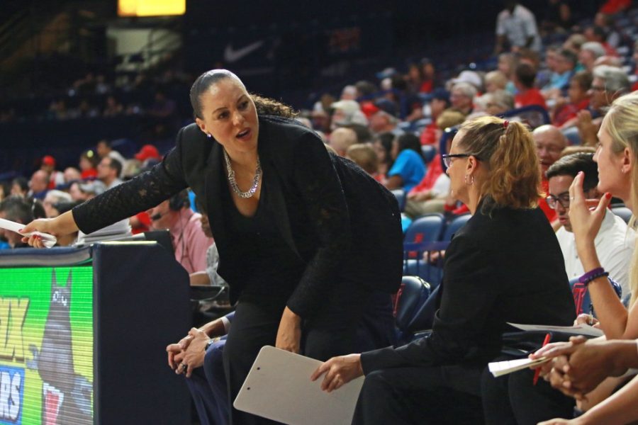 Arizona womens basketball head coach Adia Barnes signals at Charise Holloway to step in during Arizonas 74-59 win against Alcorn State on Nov. 13, 2016 in McKale Center.